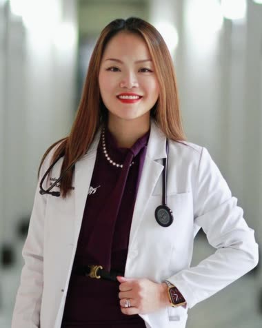 Dr. Li Huang Kruszka, DNP, APRN, FNP-C, in a white coat with a stethoscope.