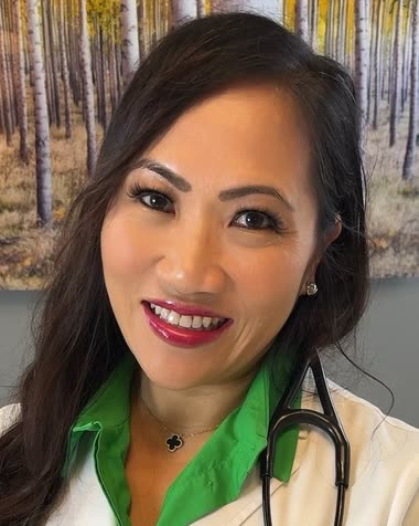 Dr. Winnie Manlai Wong, DNP, APRN, FNP-C, in a white coat with a stethoscope.